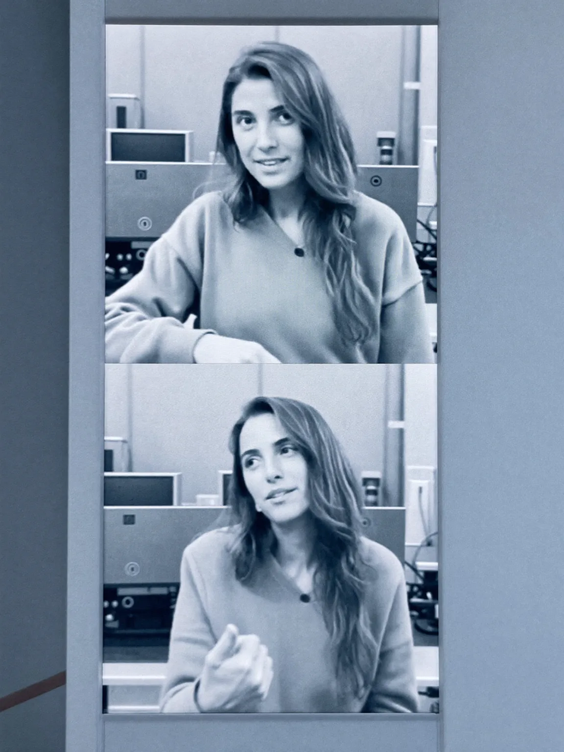 Lena speaking to camera in a render studio